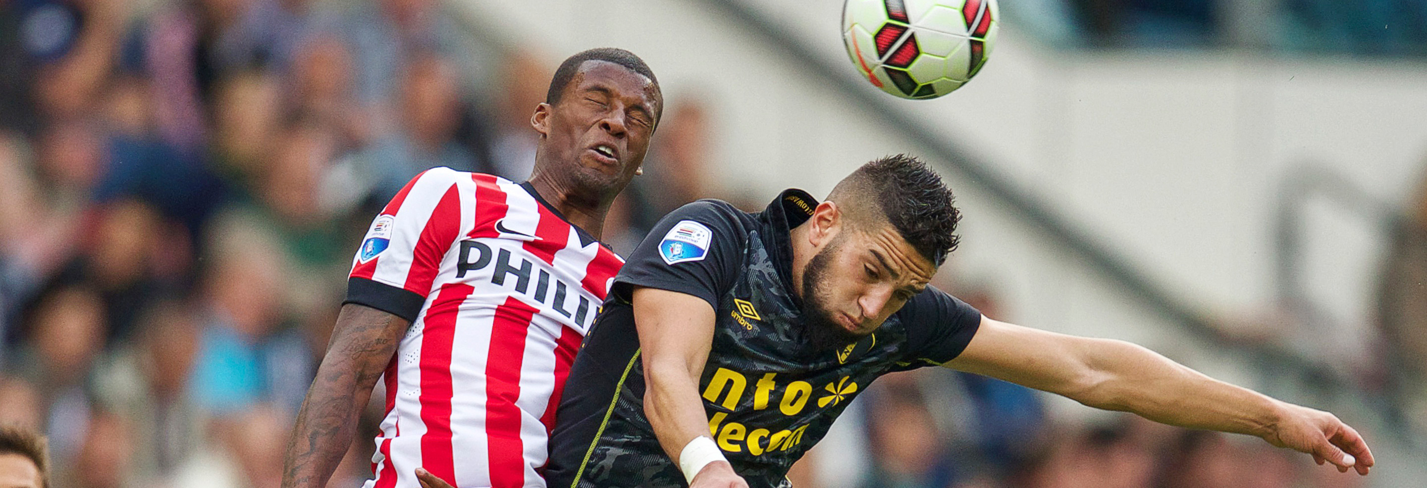 PSV-aanvoerder Georginio Wijnaldum (links) zette zijn ploeg op 1-0 en 5-1, Adnane Tighadouini (rechts) zorgde na ruim een halfuur namens NAC voor de 2-1.