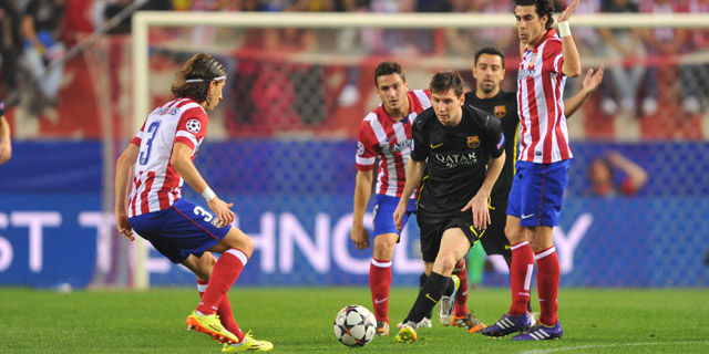 Lionel Messi, hier omringd door Filipe Luís en Tiago, kon zijn stempel niet drukken op de CL-clash tussen Atlético Madrid en Barcelona.